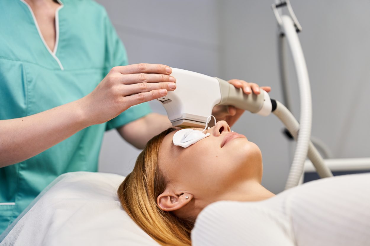 A woman receiving laser treatment from a BBL (BroadBand Light) by Sciton device at Dr. Laurel Bailey Laser and Aesthetics in Mechanicsburg, PA